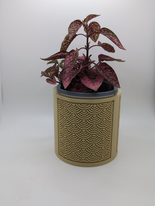 beige chinese arc planter with red and green plant