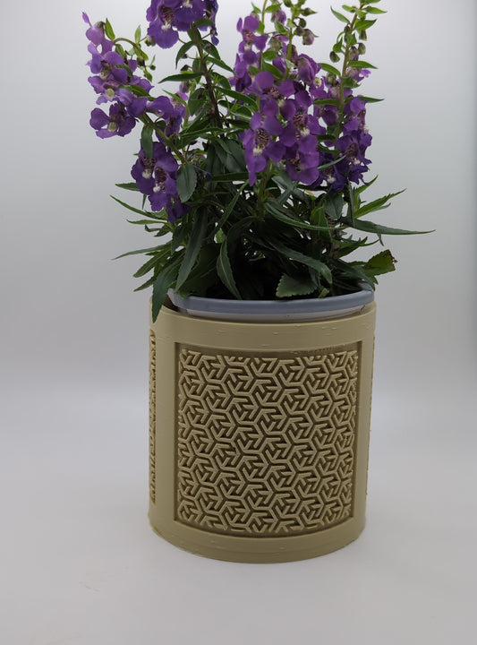beige chinese maze planter with purple flowers