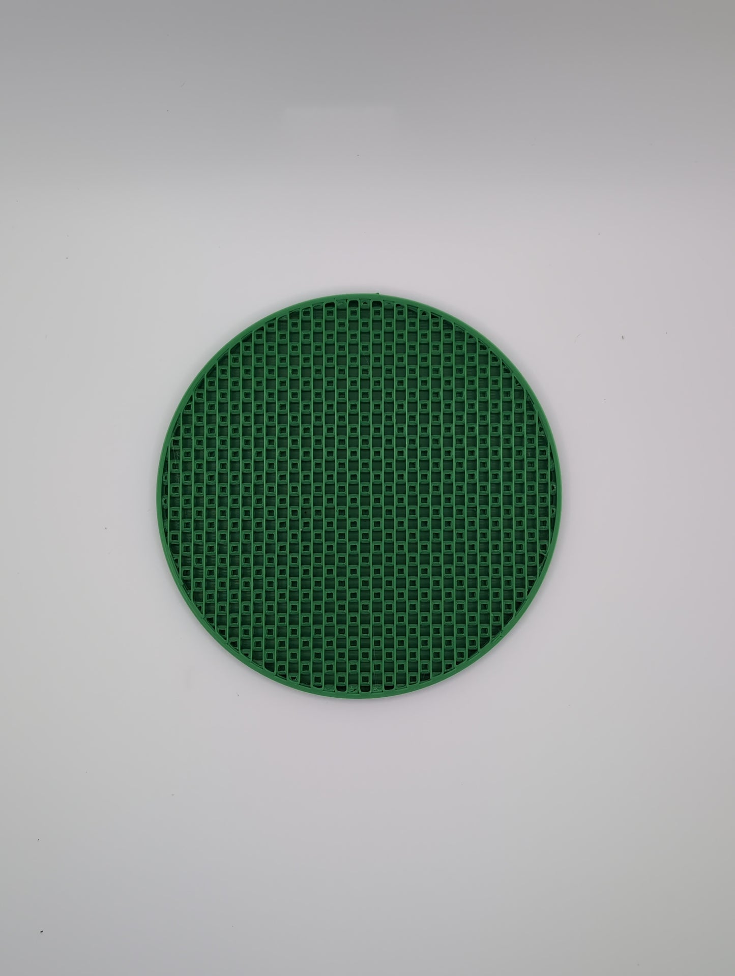 3d printed green crosshatch infill coaster
