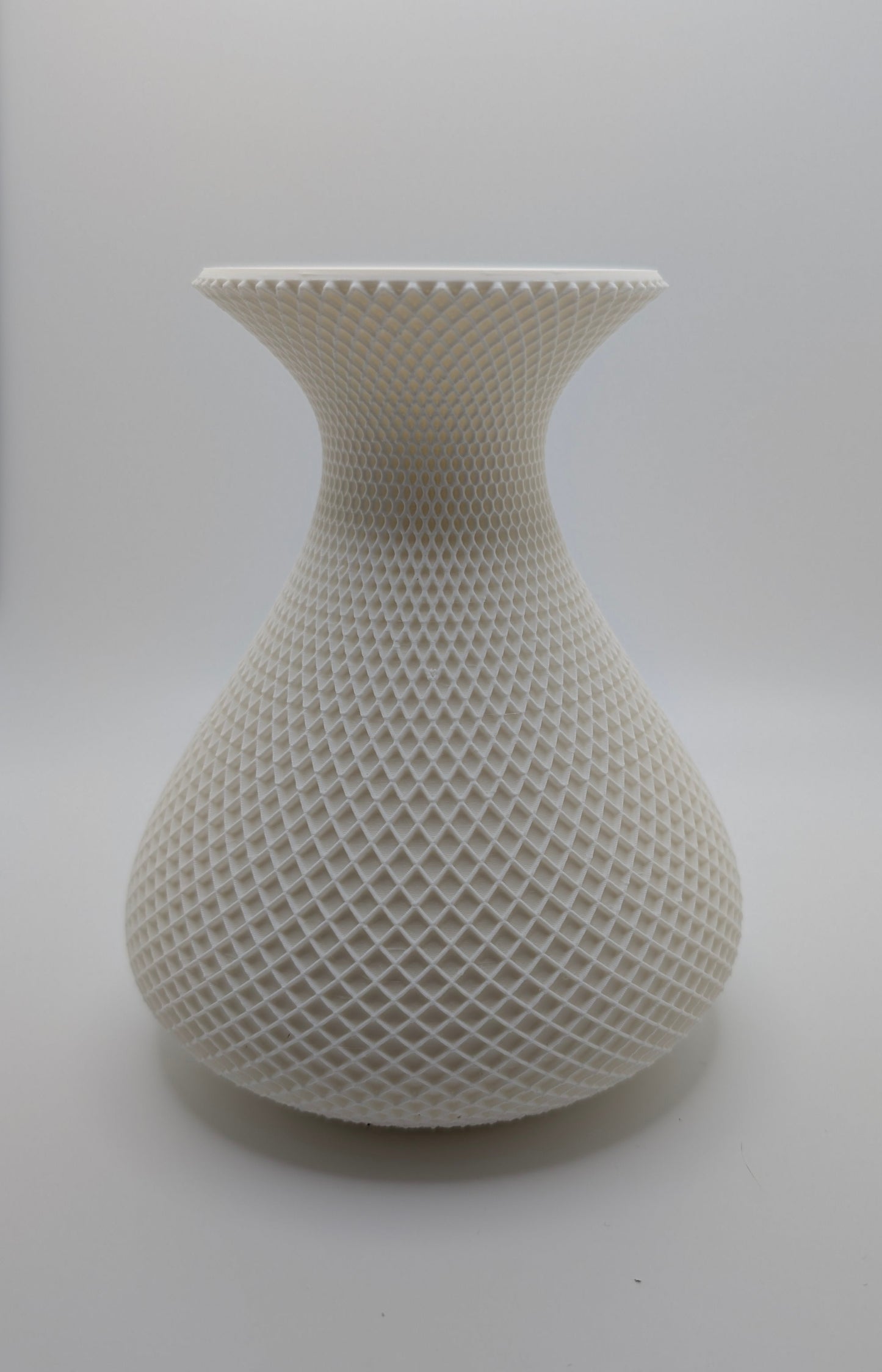 white vase with crosshatch pattern