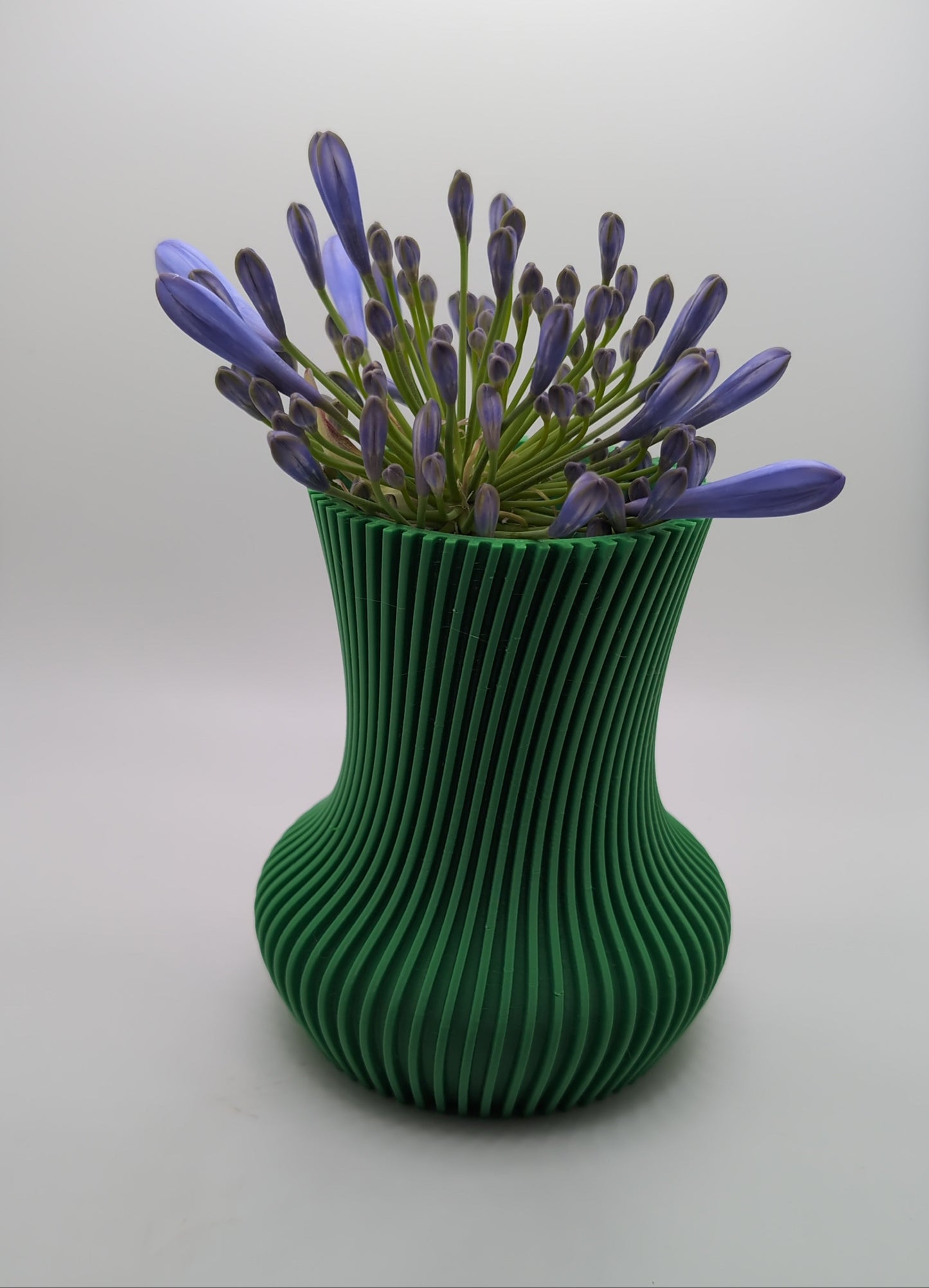 green R vase 2 with purple flowers