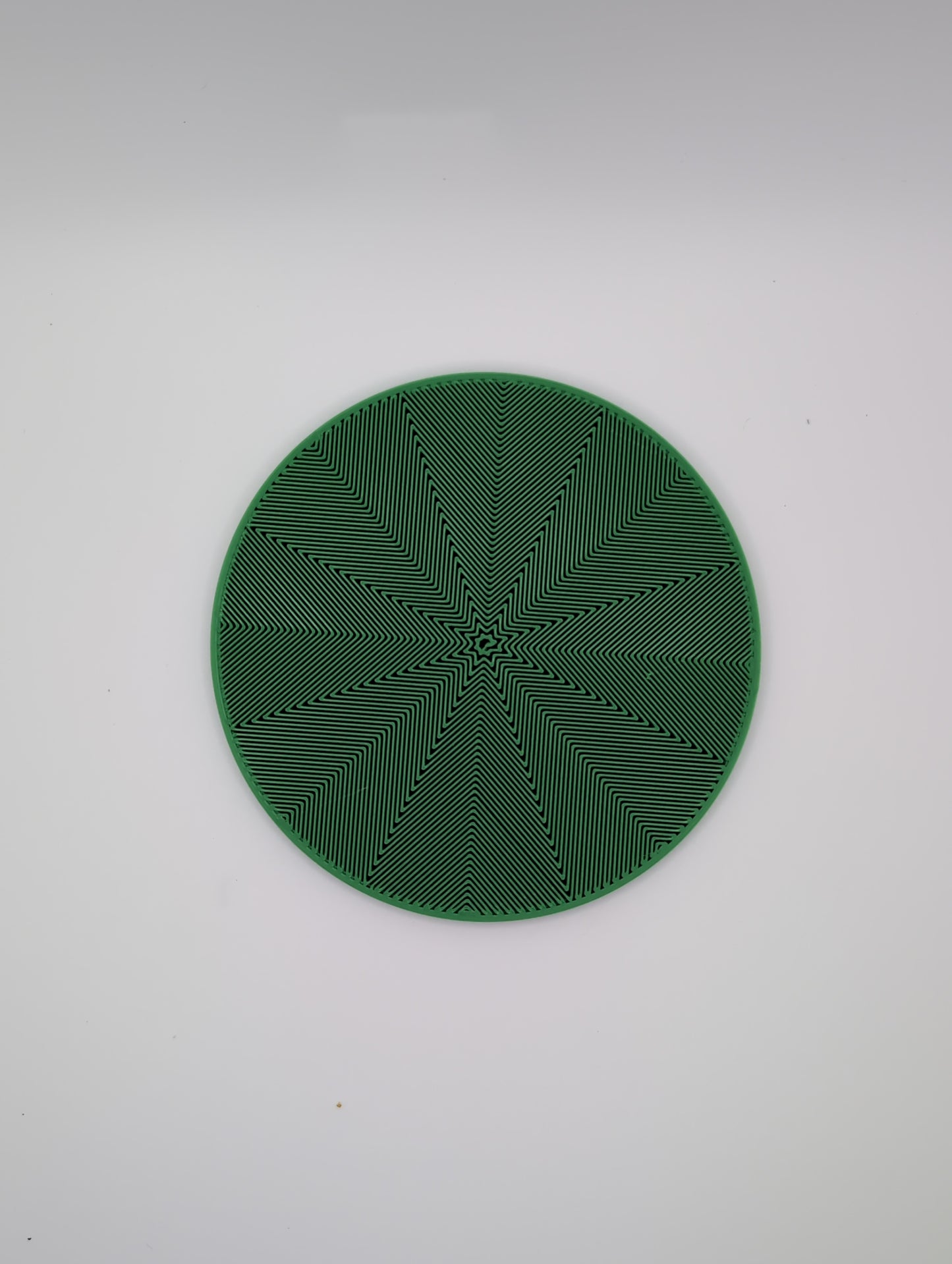 3d printed green star spiral infill coaster