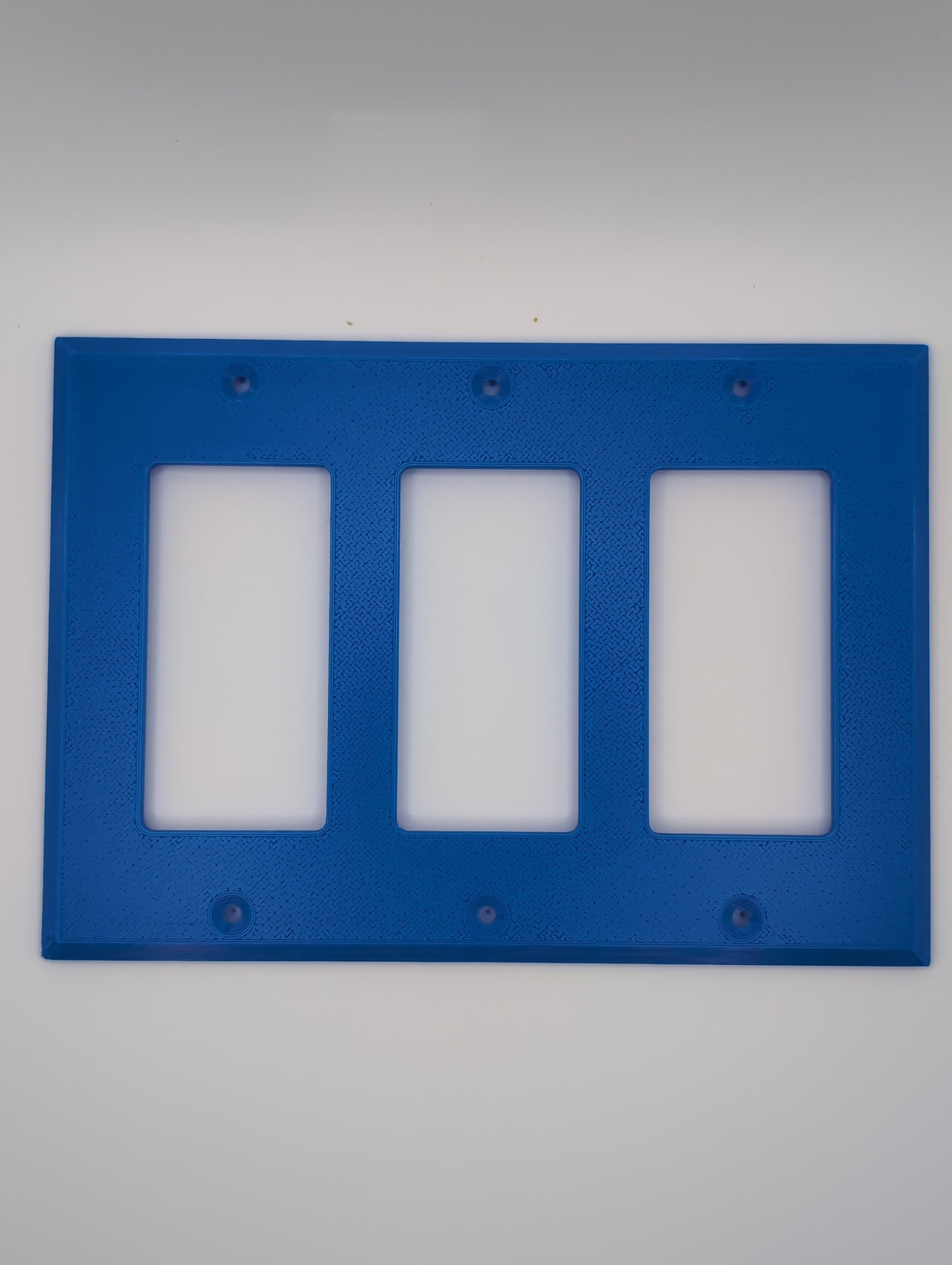 blue triple light switch cover with maze pattern