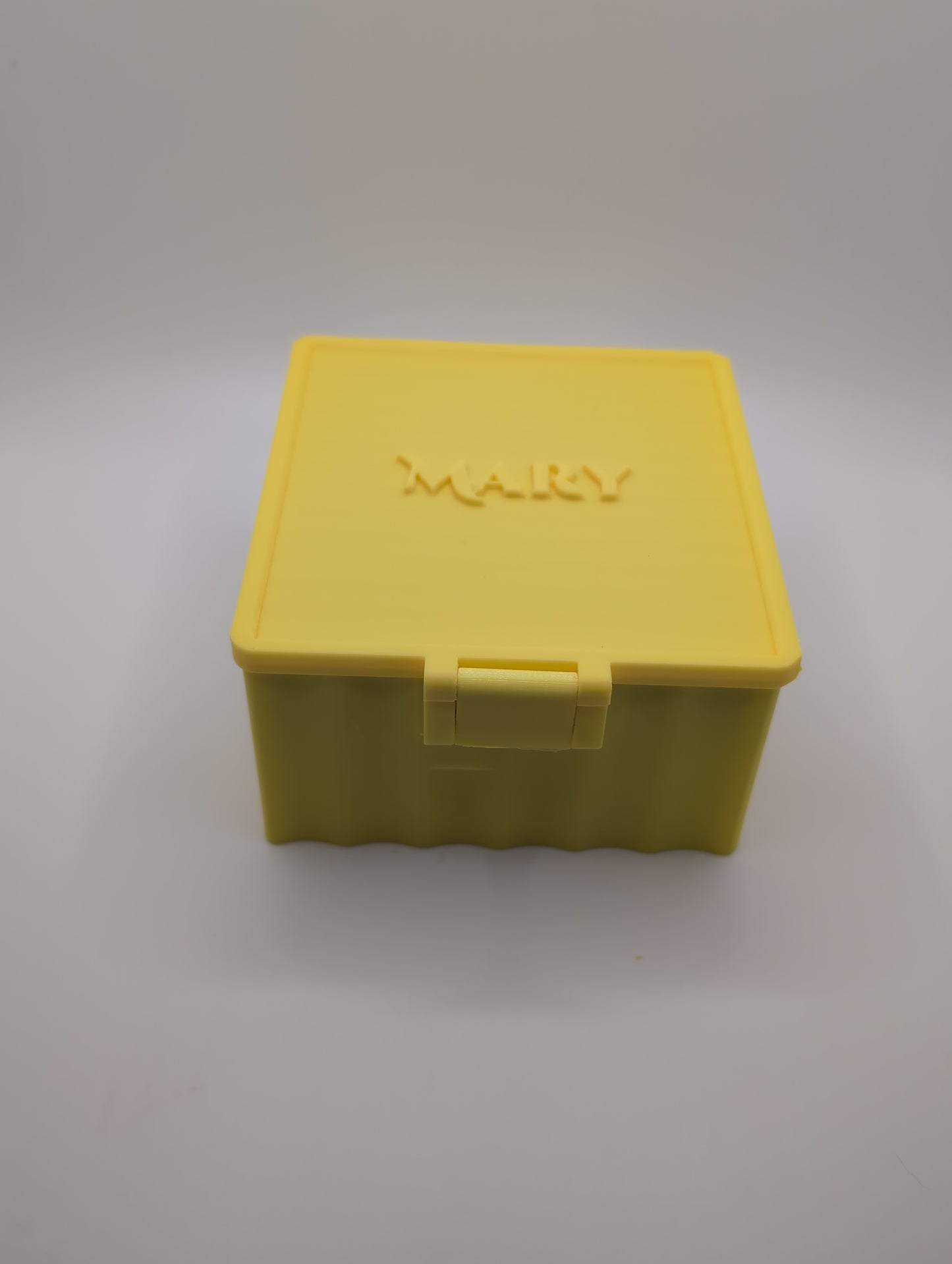 yellow customizable box with the name mary on the lid