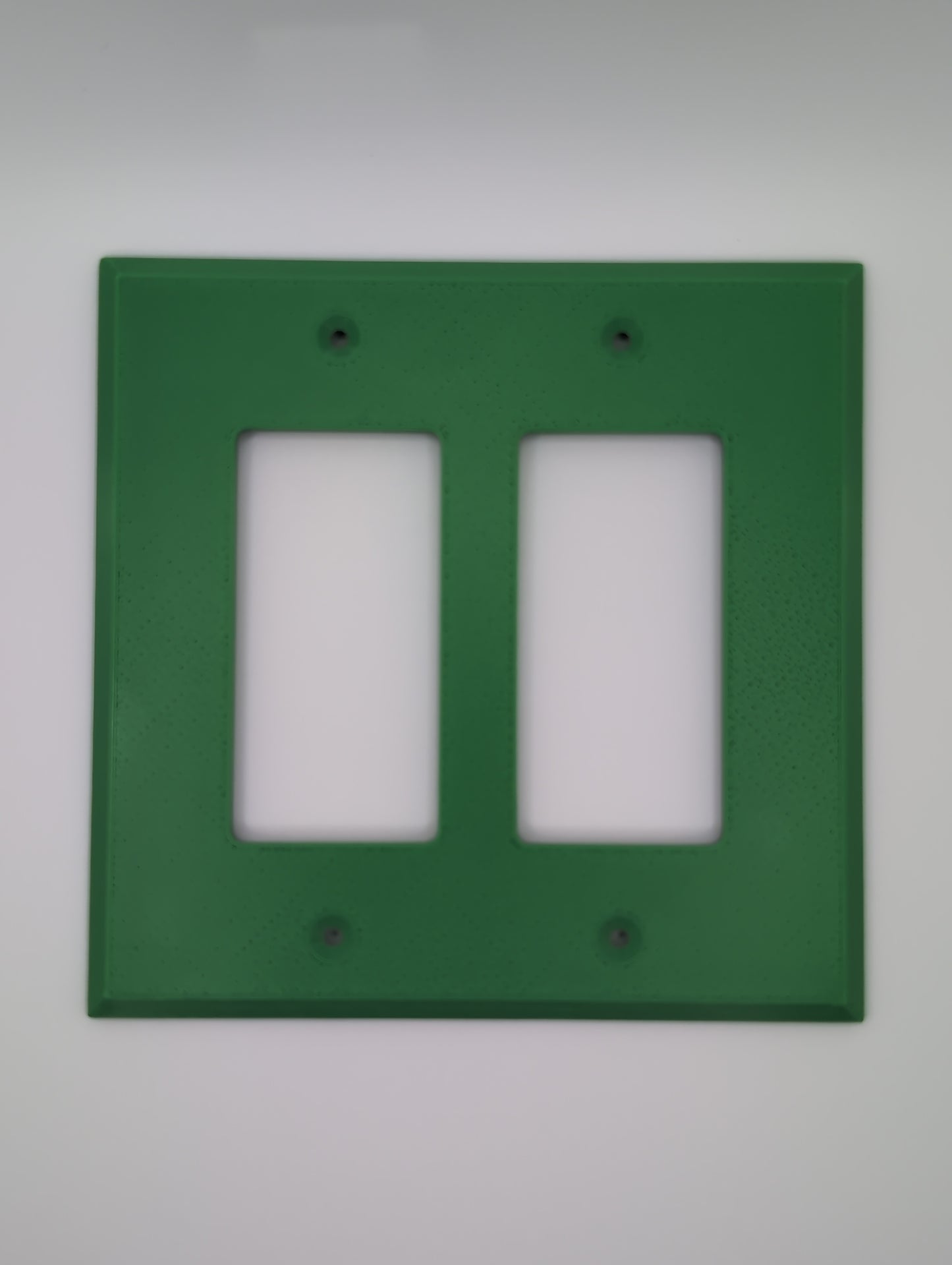 green double light switch cover with maze pattern