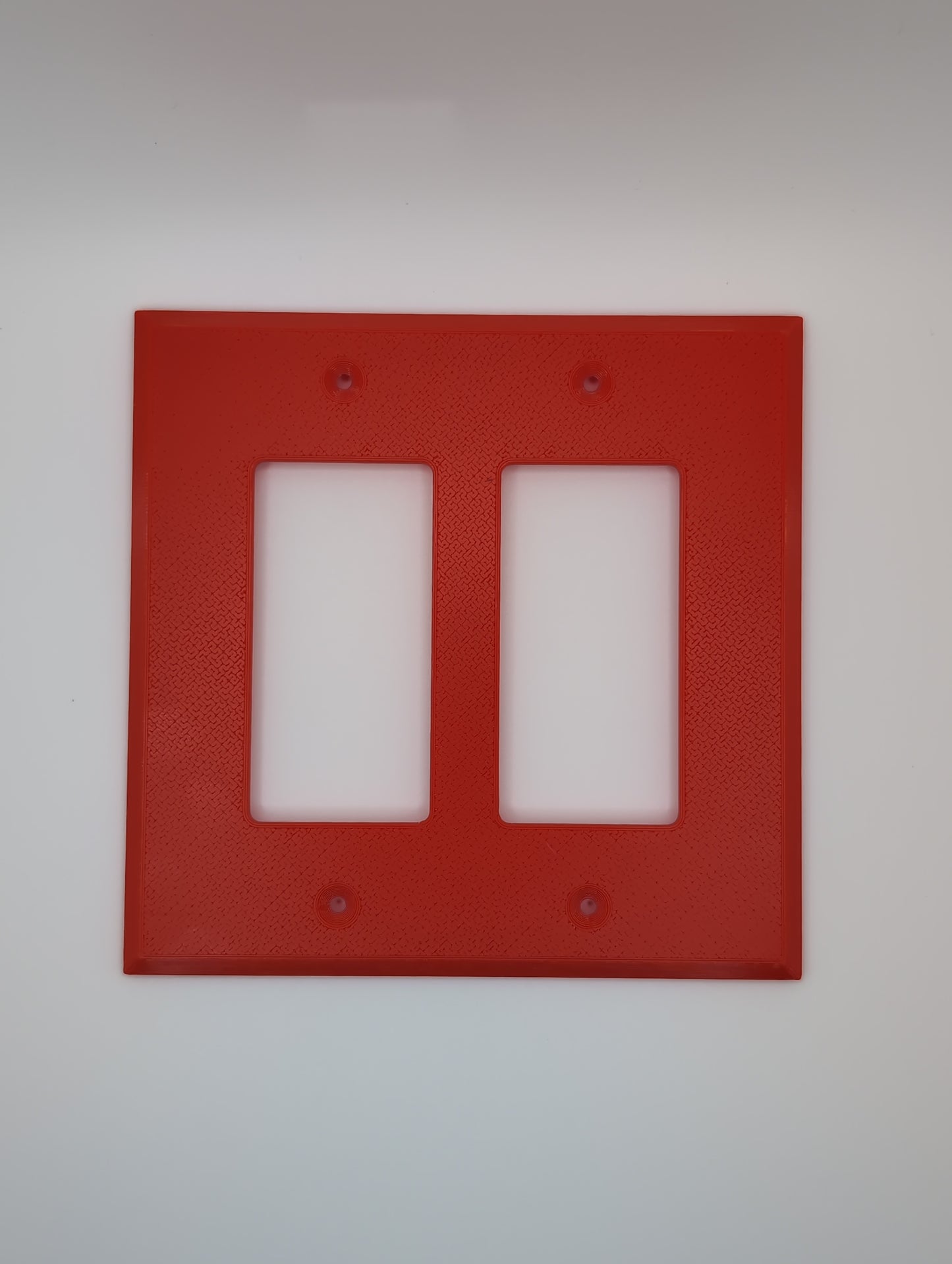 red double light switch cover with maze pattern
