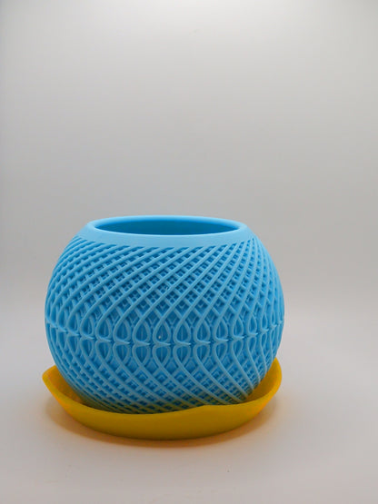 Blue planter with yellow base on a light gray background