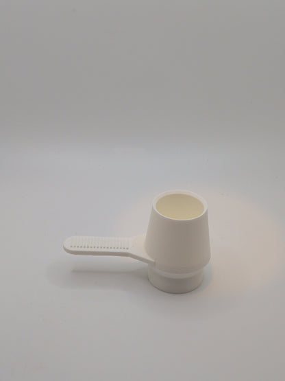 Coffee scoop with tamper