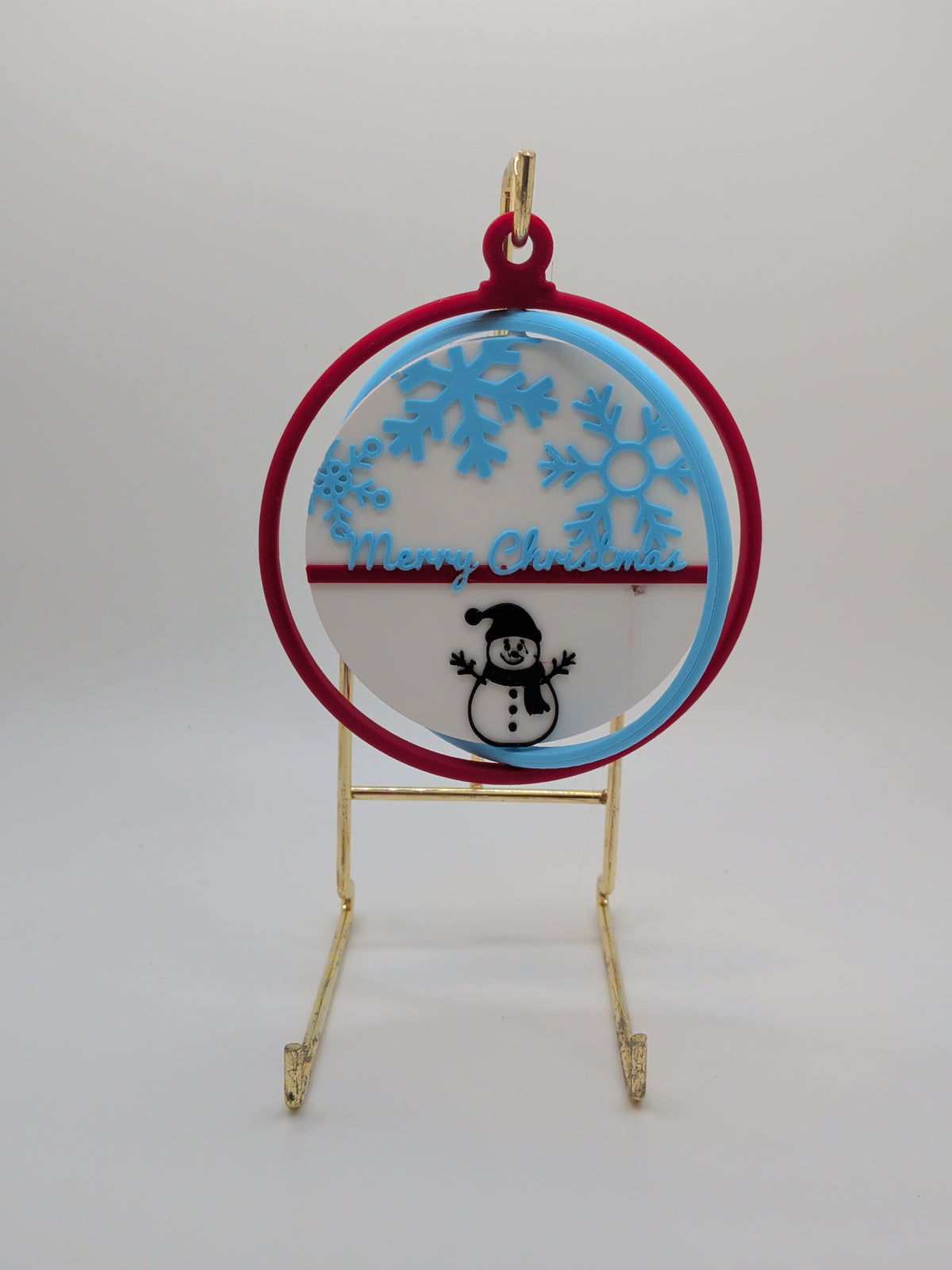 Snowflake and snowman ornament