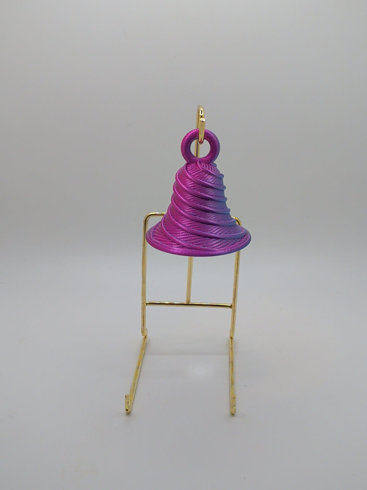Bell with twist ornament