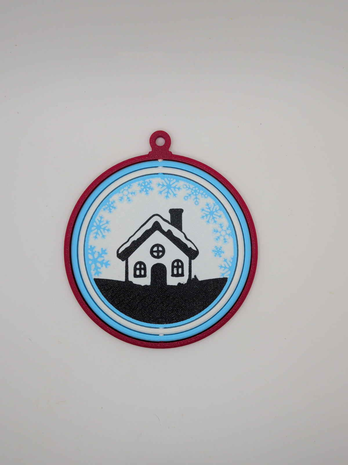 House with snowflakes ornament