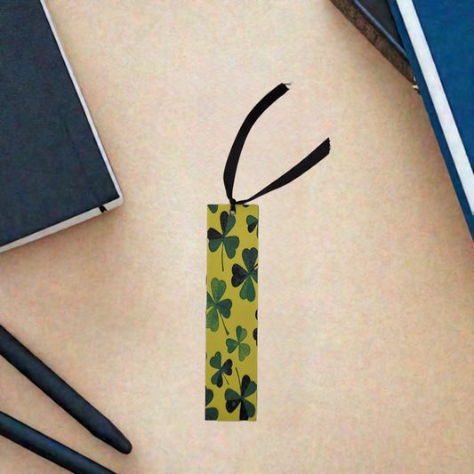 AI generated image of a shamrock bookmark surrounded by books and pens
