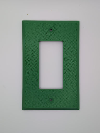 green single light switch cover with maze pattern