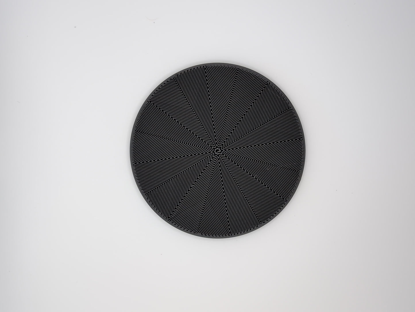 3d printed black star spiral infill coaster