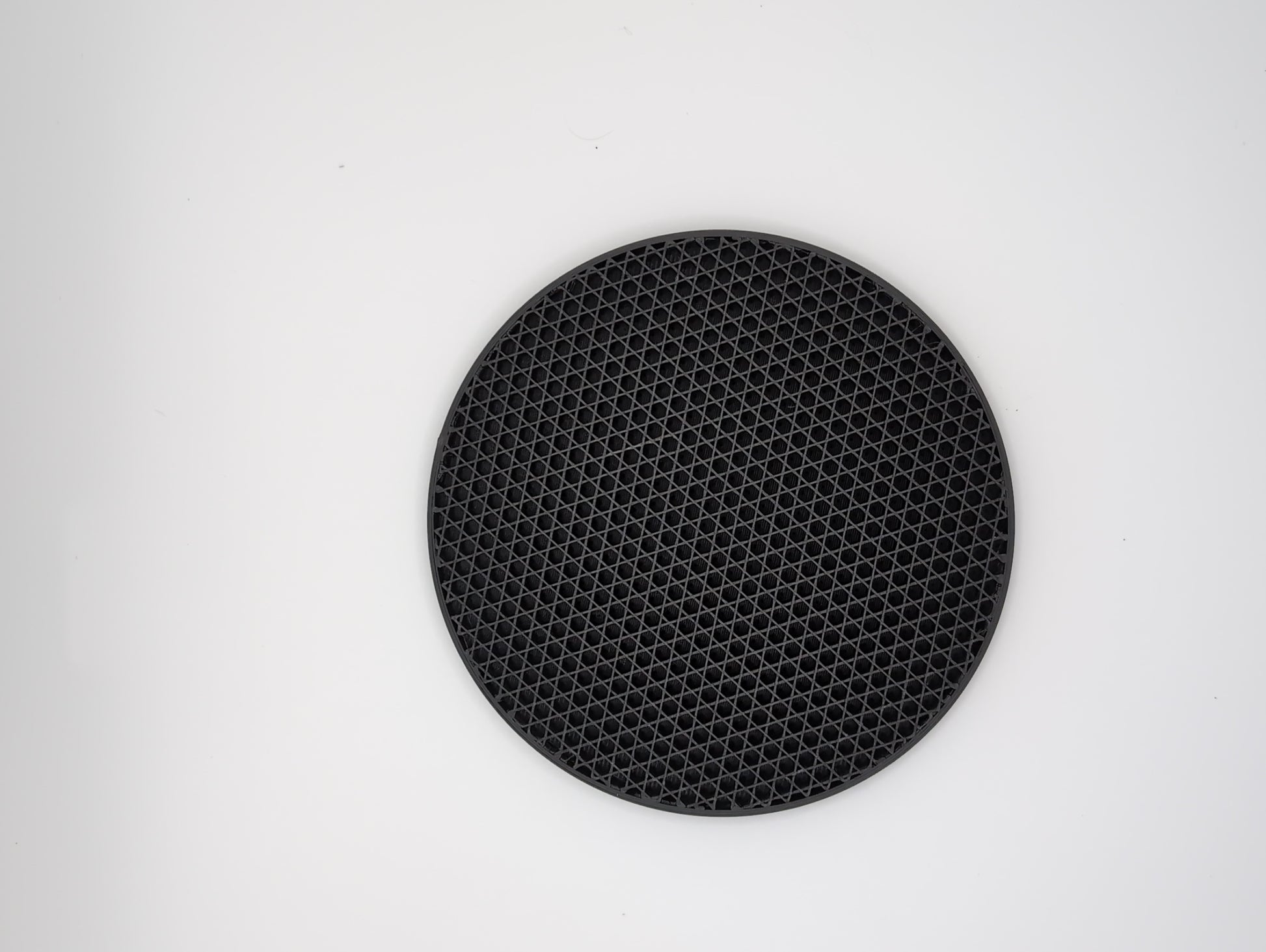 3d printed black tr-hexagon infill coaster