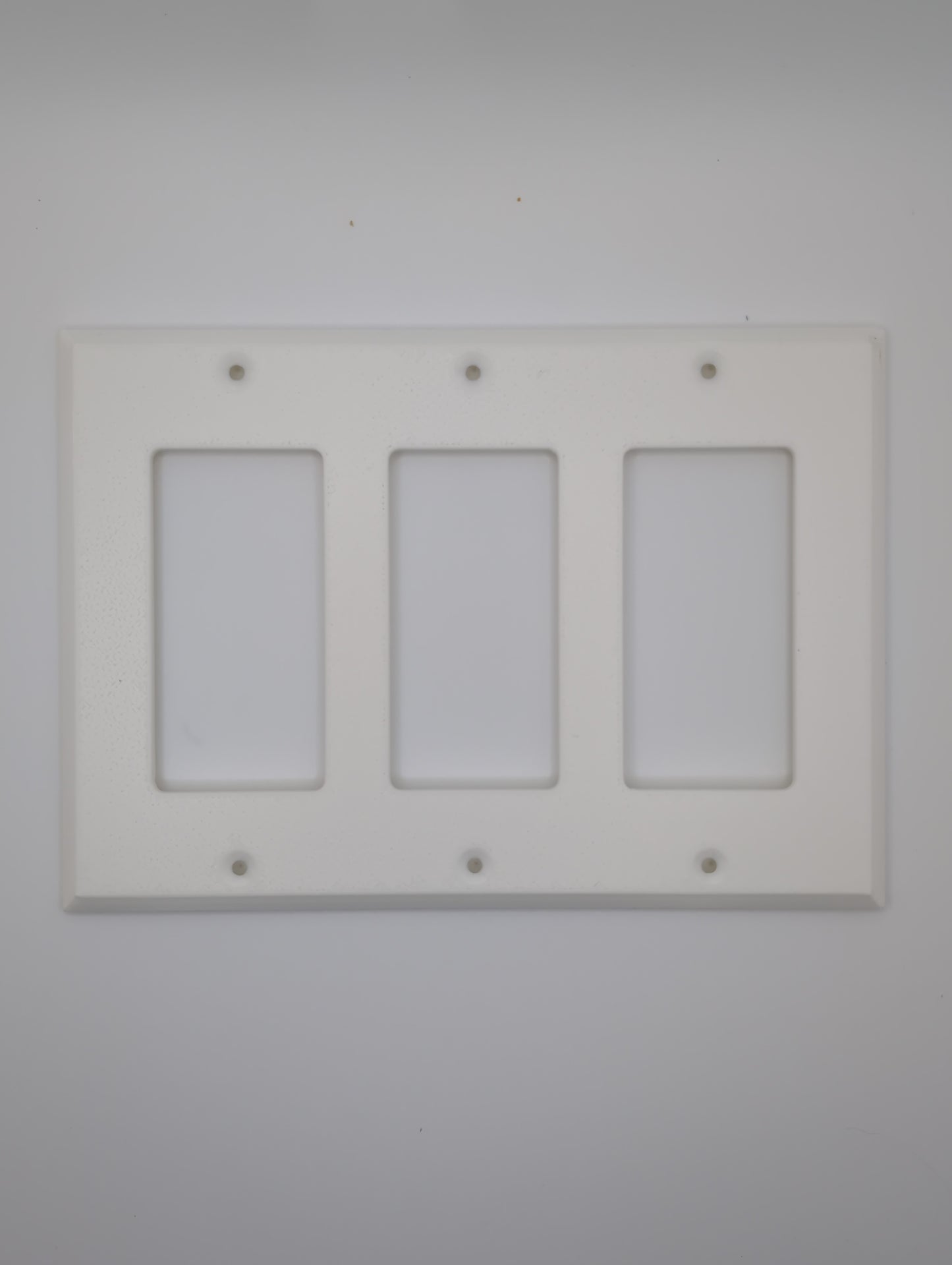 white triple light switch cover with maze pattern