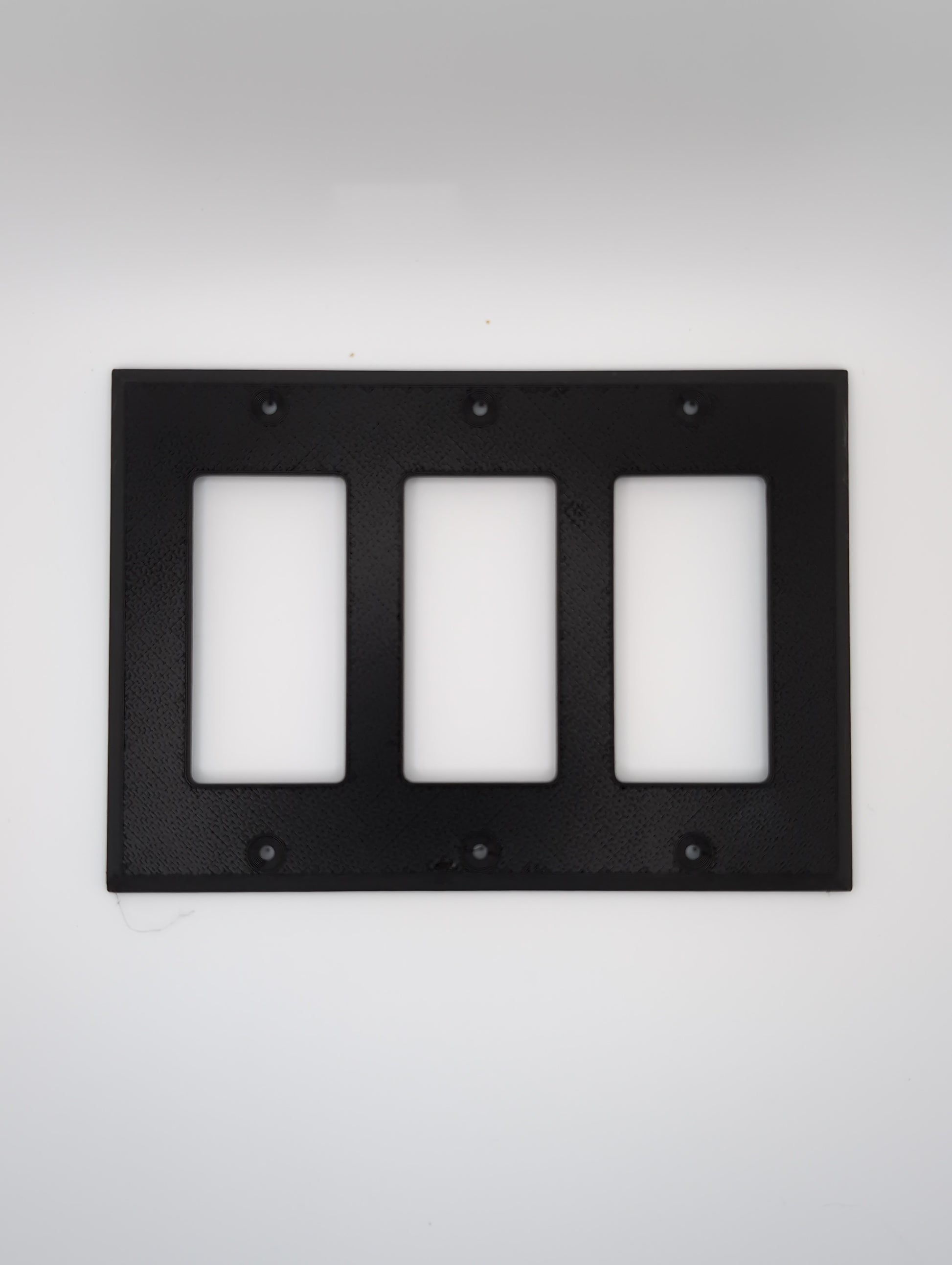 black triple switch plate with maze pattern